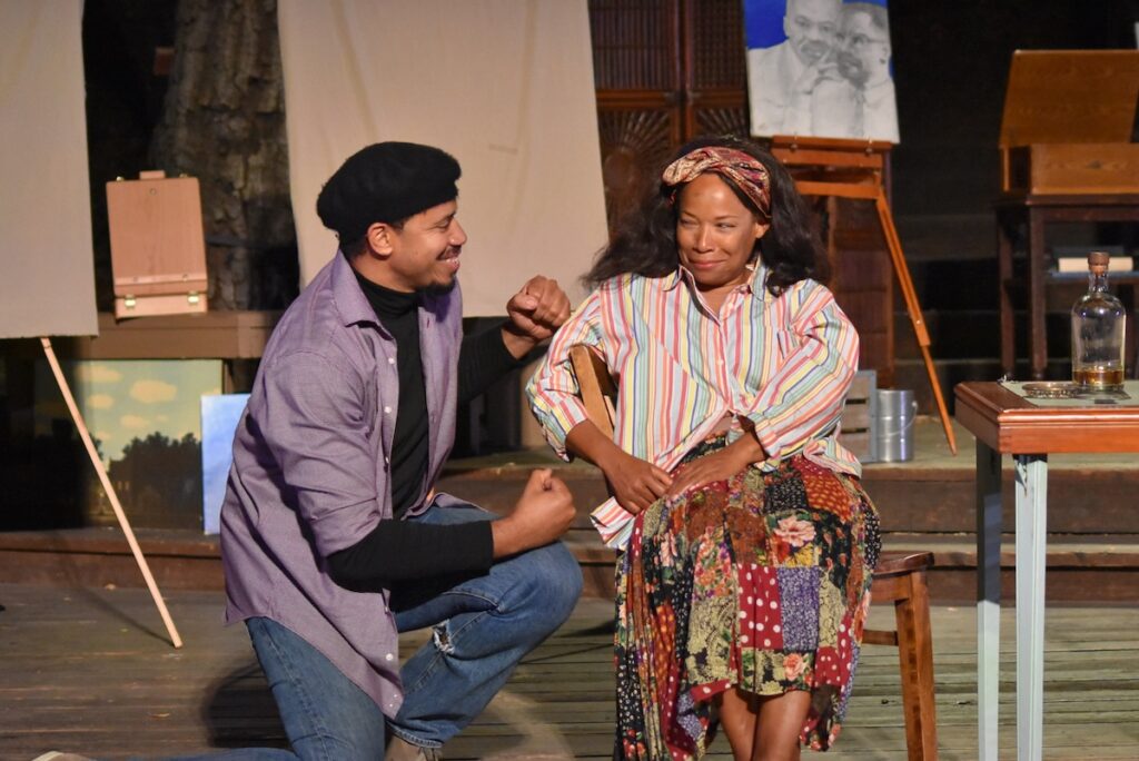 Two actors perform Wine in the Wilderness at Theatricum Botanicum outdoor theater in intimate scene