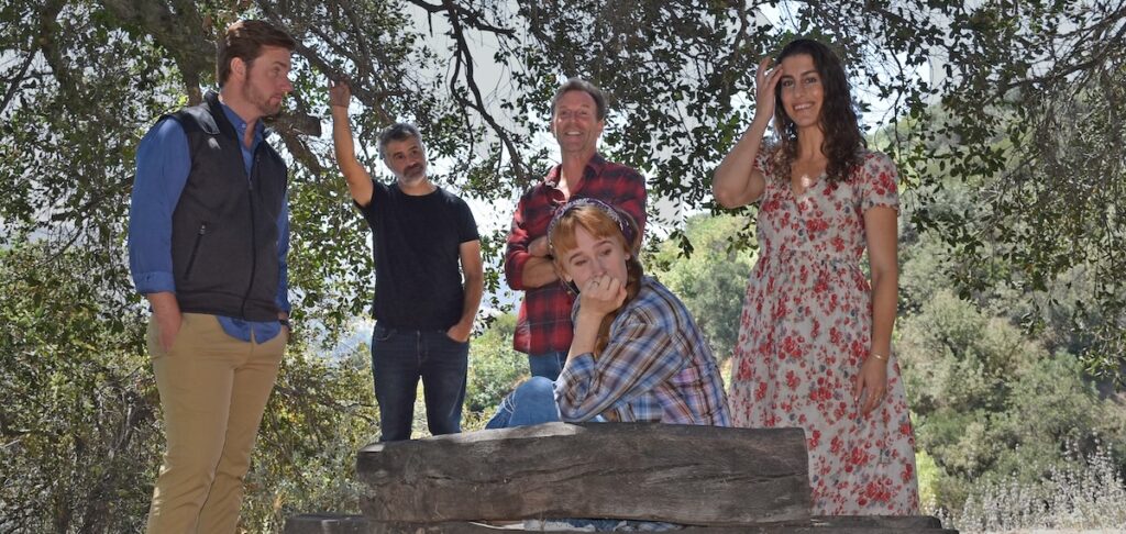 People in a circle discussing heavy matters at Theatricum Botanicum outdoor theater in Topanga Canyon for The People of Pompeii production